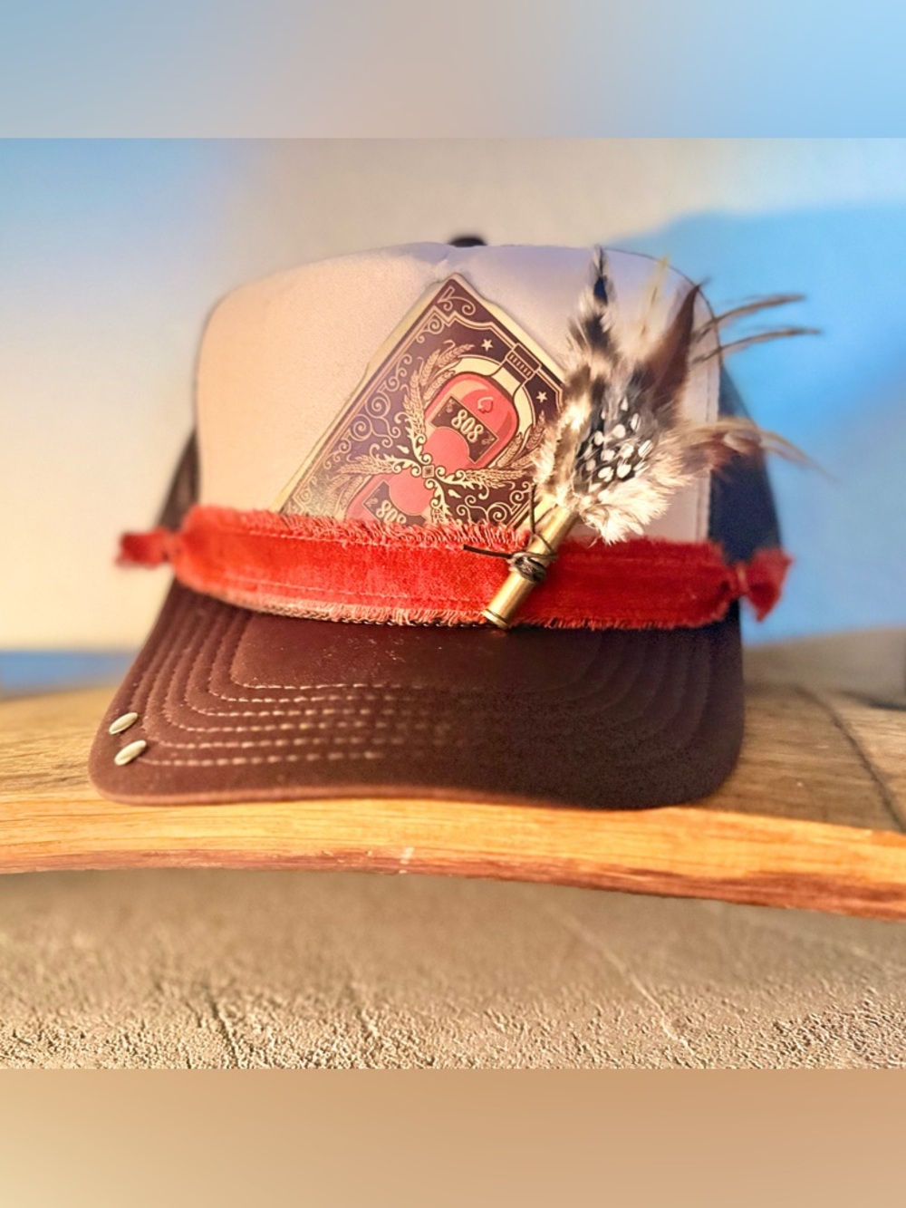 Stylish Brown & Cream Two-Tone Trucker Hat with Feather Ammo Accent